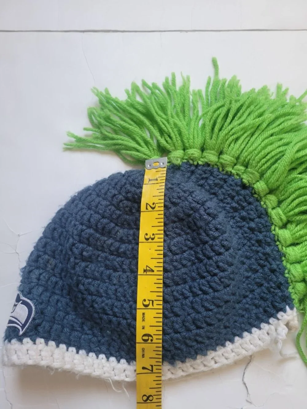 hand-crocheted Seattle Seahawks beanie blue yarn, a white brim, bright green Hat